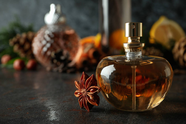 Concept of natural perfume on dark textured table, space for text - 写真・画像