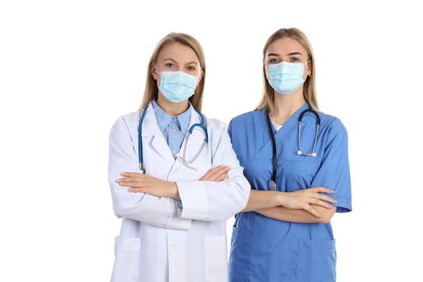 Female doctor and nurse isolated on white background - Fotoğraf, Görsel