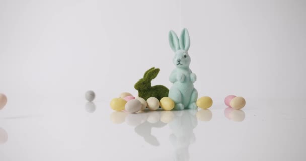 Bunny on a White Background, many colored eggs. Happy Easter day. Text message - Footage, Video