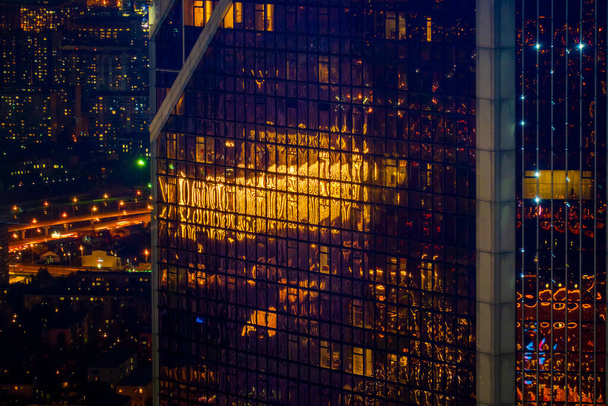 Skyscrapers with glass walls at night - Photo, Image