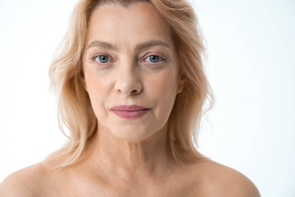 Horizontal shot of the calm middle aged woman with perfect skin - Foto, Imagem