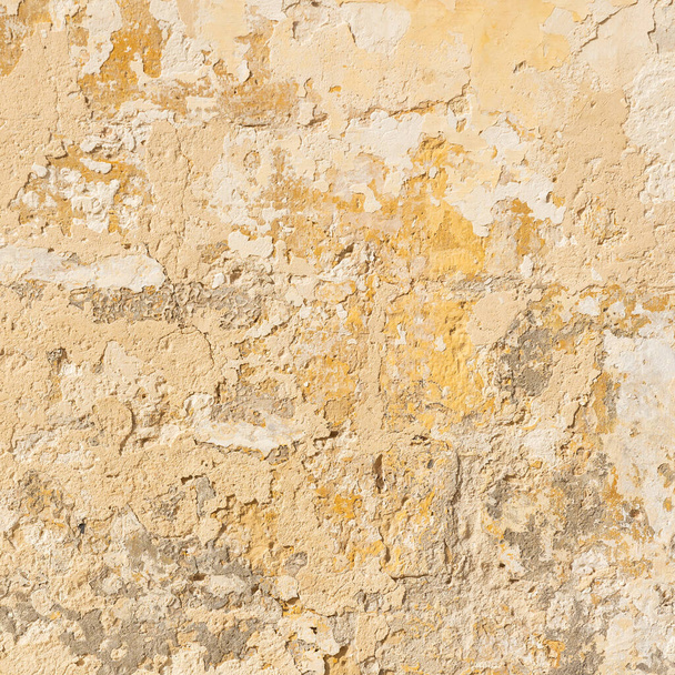 Pared de piedra con textura amarilla gastada, plano cuadrado - Foto, imagen