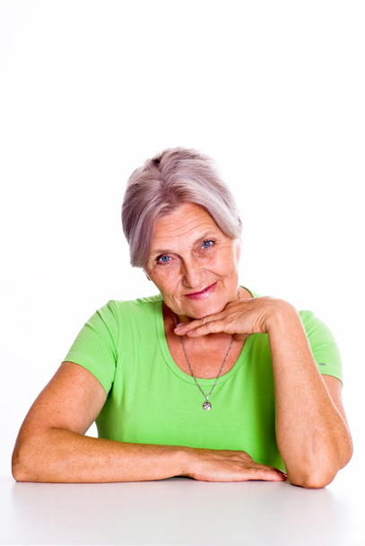 Beautiful older woman in green - Fotoğraf, Görsel