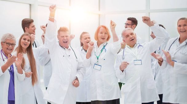 group of medical colleagues applauding their overall success. - Foto, Imagem