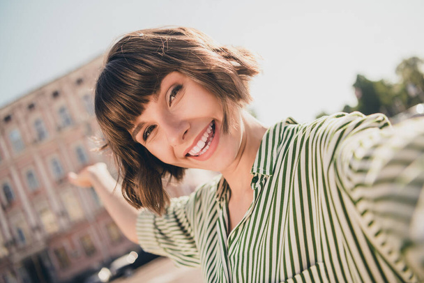 Photo of glad friendly blogger influencer traveler lady shoot selfie show town wear striped shirt urban city outdoors - Foto, Bild