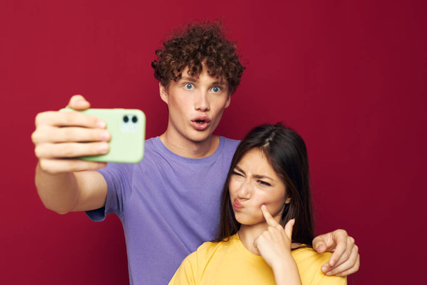 a young couple modern style emotions fun phone Youth style - Foto, Imagen