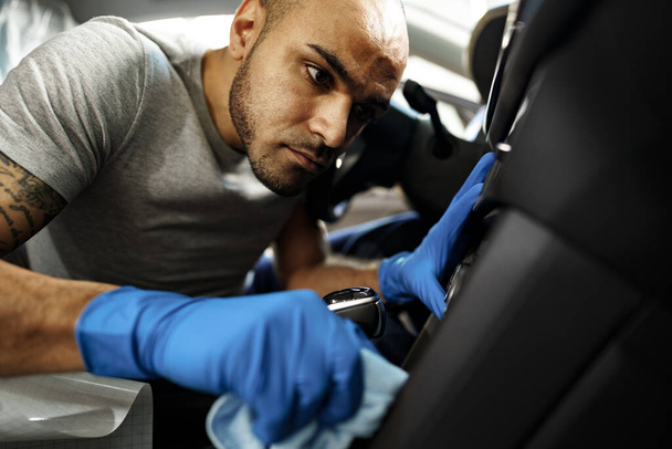 A man cleaning car interior, car detailing in Carwash service - Fotó, kép