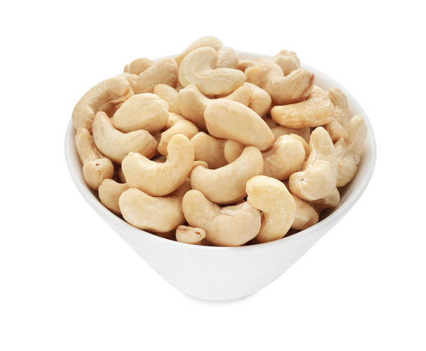 Bowl of tasty organic cashew nuts isolated on white - Valokuva, kuva