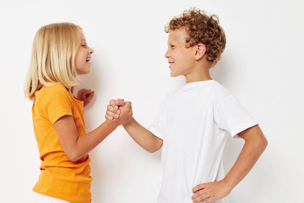 boy and girl holding hands friendship fun childhood - Photo, image