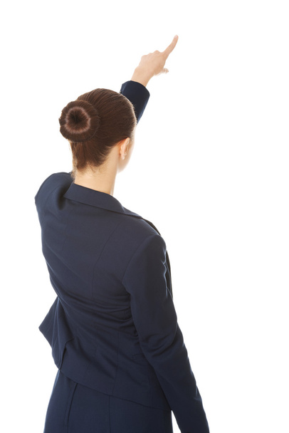 Business woman pointing on copy space. - Foto, Imagen