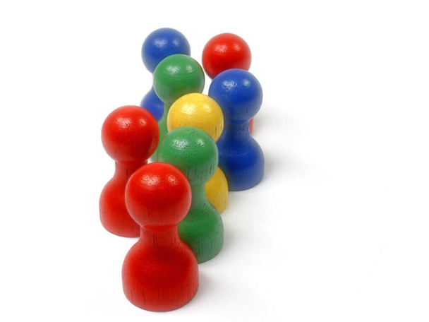 Eight colorful wooden skittles against a white background - Photo, Image