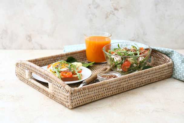Tray with tasty breakfast on grunge background - Photo, Image