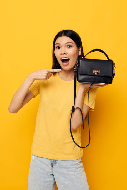 pretty woman female clutch bag fashion posing isolated background - Valokuva, kuva