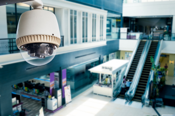 CCTV Camera of Surveillance operating in blue biulding - Photo, Image