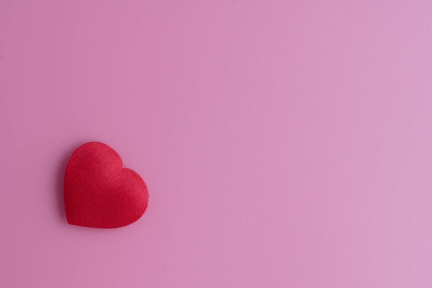 Classic background for girls, pink, bland, soft colors, red fabric heart on the bottom left. Reminds of love, kindness, Valentine's Day and delights. - Foto, Bild
