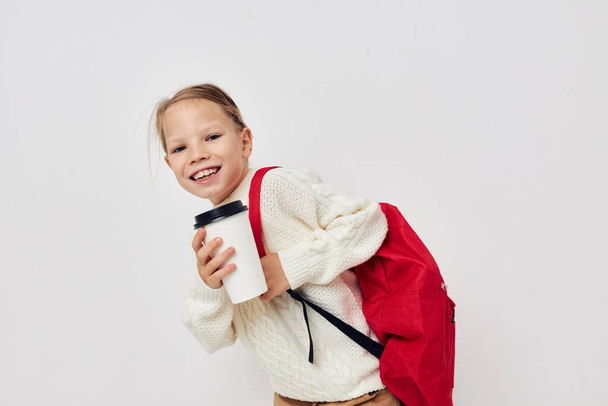 little girl school red backpack posing isolated background - Fotó, kép