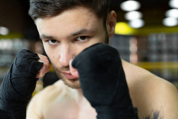 Portrait of a boxer with bandages on his hands. The concept of sport - Fotó, kép