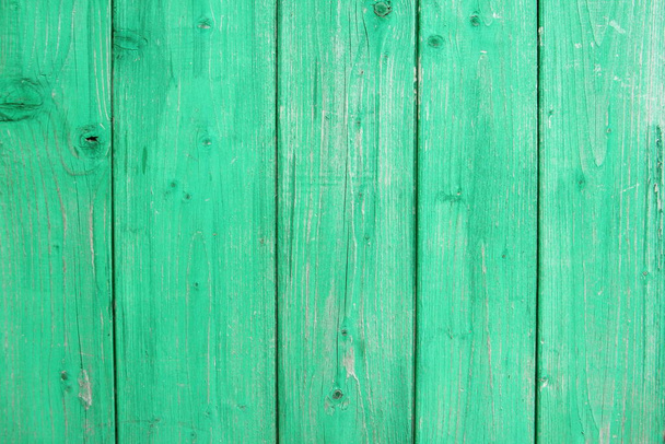 Old green wooden wall with cracked paint, background texture. - Photo, Image