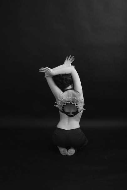 art photography, dancer expresses emotions through movement, body abstraction on black background - Foto, Imagem