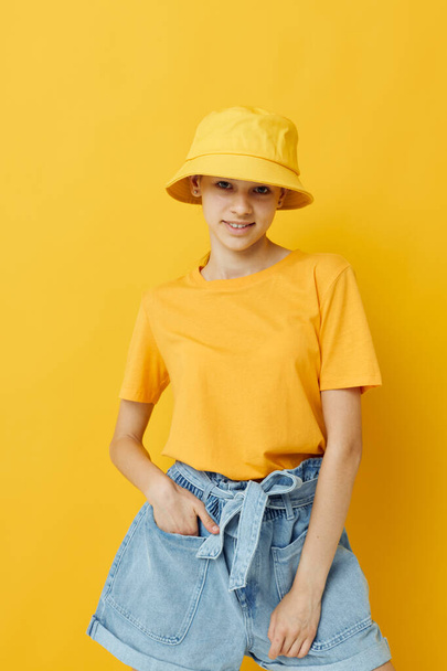 optimistic young woman in a yellow hat Youth style casual wear isolated background - Foto, Imagem