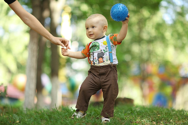 Child playing with ball in park - Φωτογραφία, εικόνα