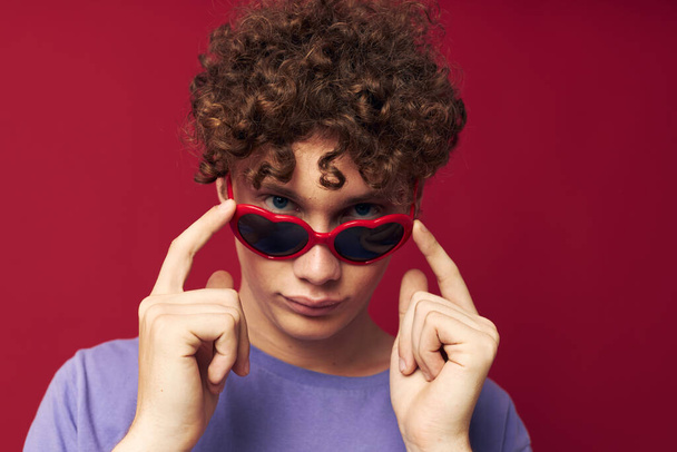 guy with red curly hair summer style fashion sunglasses isolated background - 写真・画像