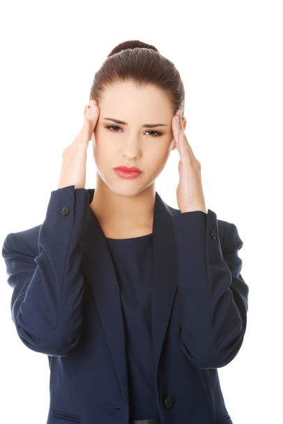 Young woman suffering a headache - Фото, зображення