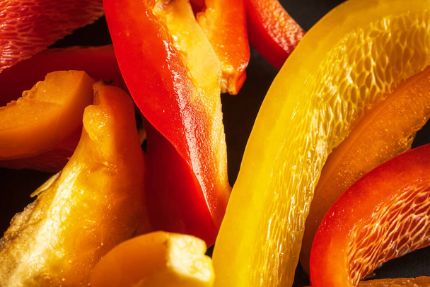 fresh cut pepper closeup colorful pattern background - Photo, image