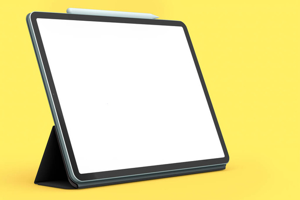 Tableta de ordenador con funda azul y lápiz aislado sobre fondo amarillo. - Foto, imagen