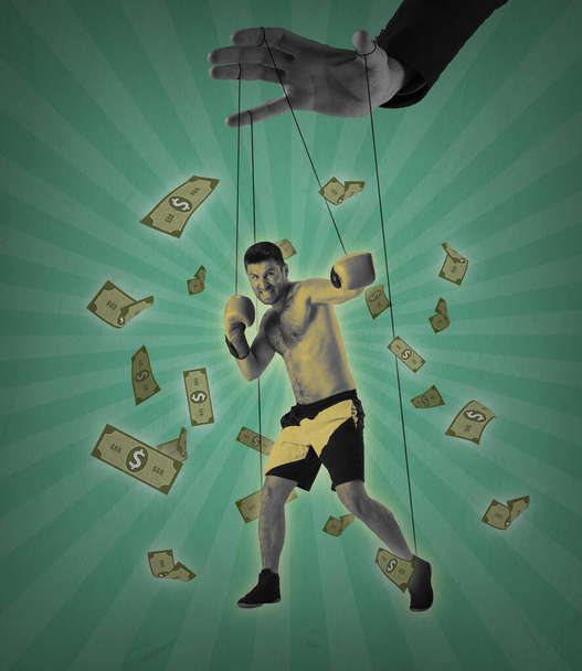 Sportive man, boxer like puppet in male hand on green background with cinematic retro effect. Contemporary art collage - Foto, imagen