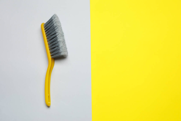 Plastic hand broom on color background, top view. Space for text - Valokuva, kuva