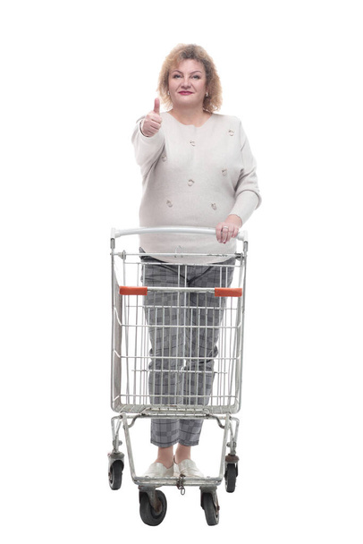 full-length. casual adult woman with shopping cart. - Zdjęcie, obraz