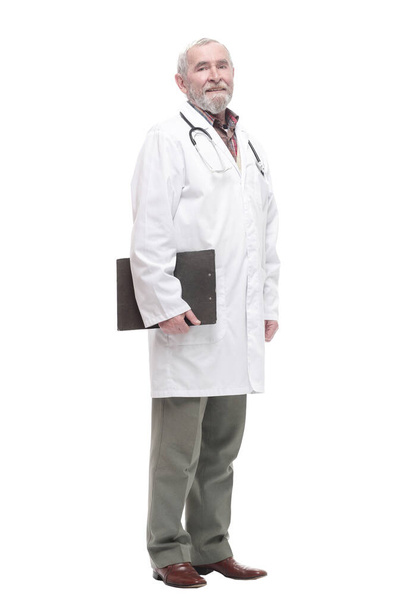 elderly competent doctor with clipboard. isolated on a white - Photo, Image