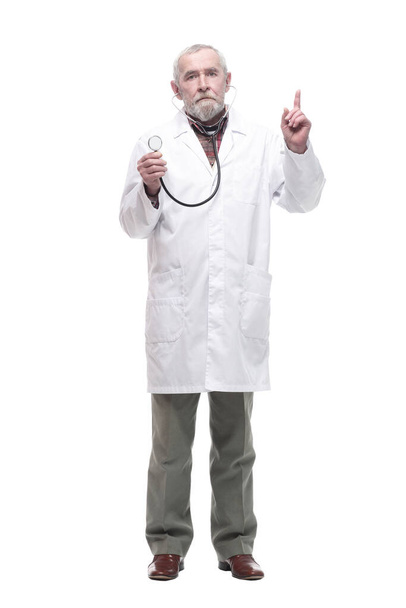 elderly competent doctor with a stethoscope in his hands. - Fotografie, Obrázek