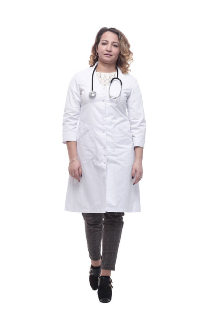 young female doctor with a stethoscope striding forward. - Zdjęcie, obraz