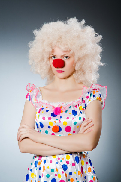 Clown with white wig against grey background - Photo, Image
