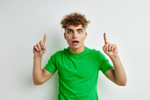 Attractive man in green t-shirts emotions posing isolated background - Fotoğraf, Görsel