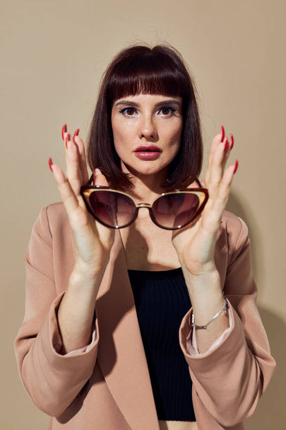 photo pretty woman Charm red nails model luxury sunglasses isolated background - Zdjęcie, obraz