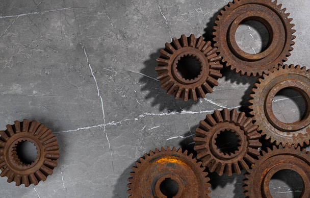 Old rusty metal gears on a gray background - Zdjęcie, obraz