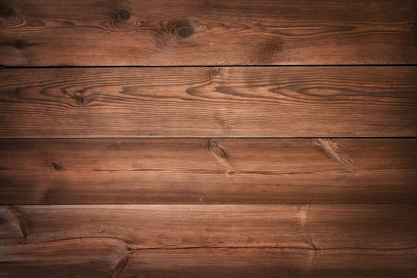 Aged textured wooden background. Rough and detailed surface of an old dark brown table - Foto, afbeelding