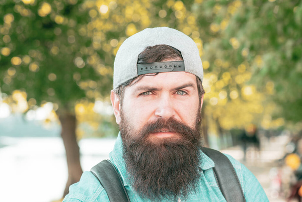 Bearded man outdoor. Spring park. Close up men portrait. - Fotó, kép