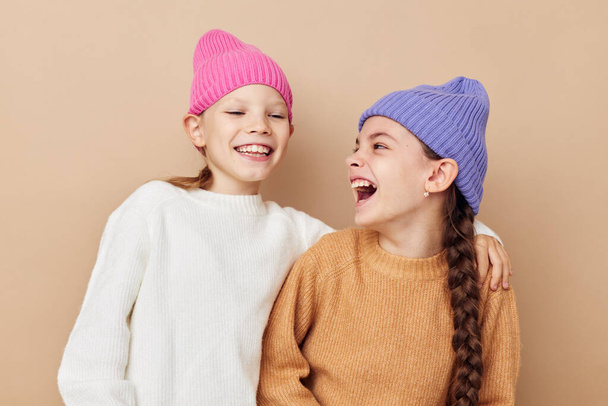 two cute little girls wearing hats fashion childhood - Zdjęcie, obraz