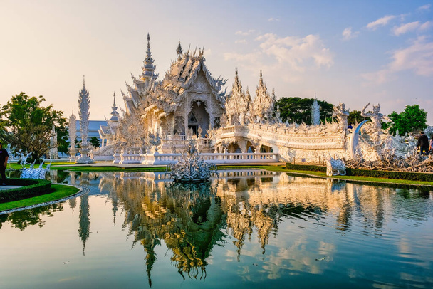 White temple Chiang Rai during sunset, Evening view of Wat Rong Khun or White Temple, Landmark in Chiang Rai, Thailand - Photo, Image