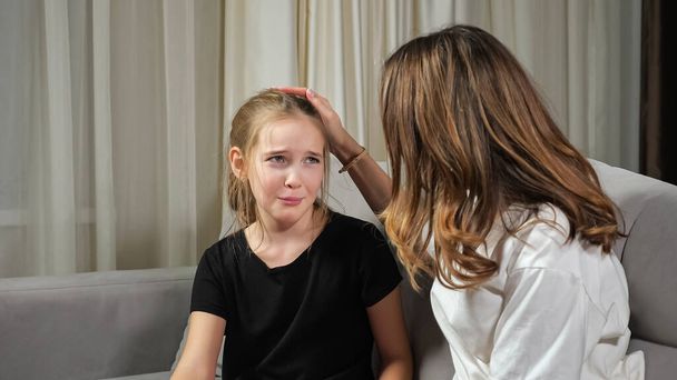 Teen girl complains crying while mother calms daughter - Fotografie, Obrázek