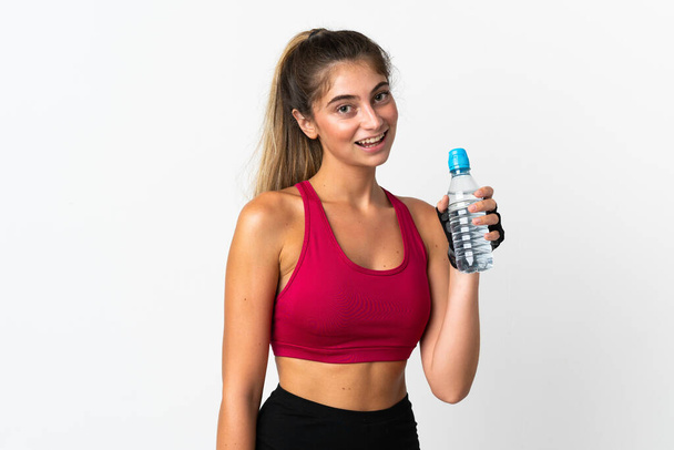 Young caucasian woman isolated on white background with sports water bottle - Photo, Image