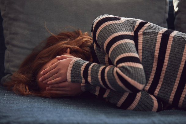 Teenage girl being upset and crying at home. - Foto, Bild