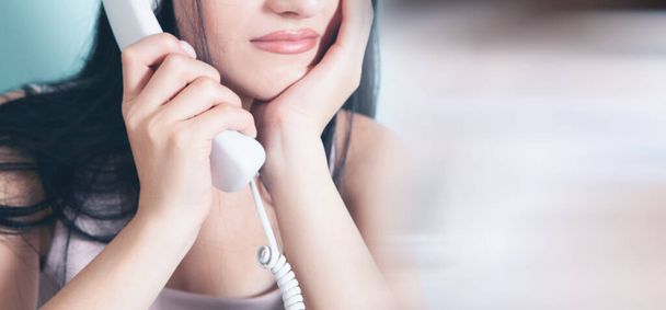 woman talking on a wired home phone - Foto, Imagem