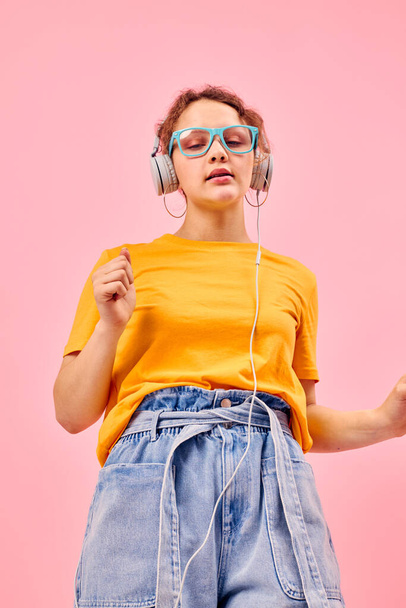 portrait of a young woman grimace headphones music entertainment technology cropped view unaltered - Fotó, kép