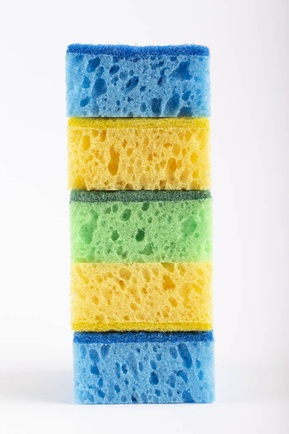 Colored sponges for washing dishes and other domestic needs on a white background.  - Fotografie, Obrázek