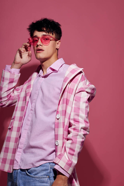 Photo of romantic young boyfriend pink shirt and glasses jacket fashion elegant style Lifestyle unaltered - Foto, imagen